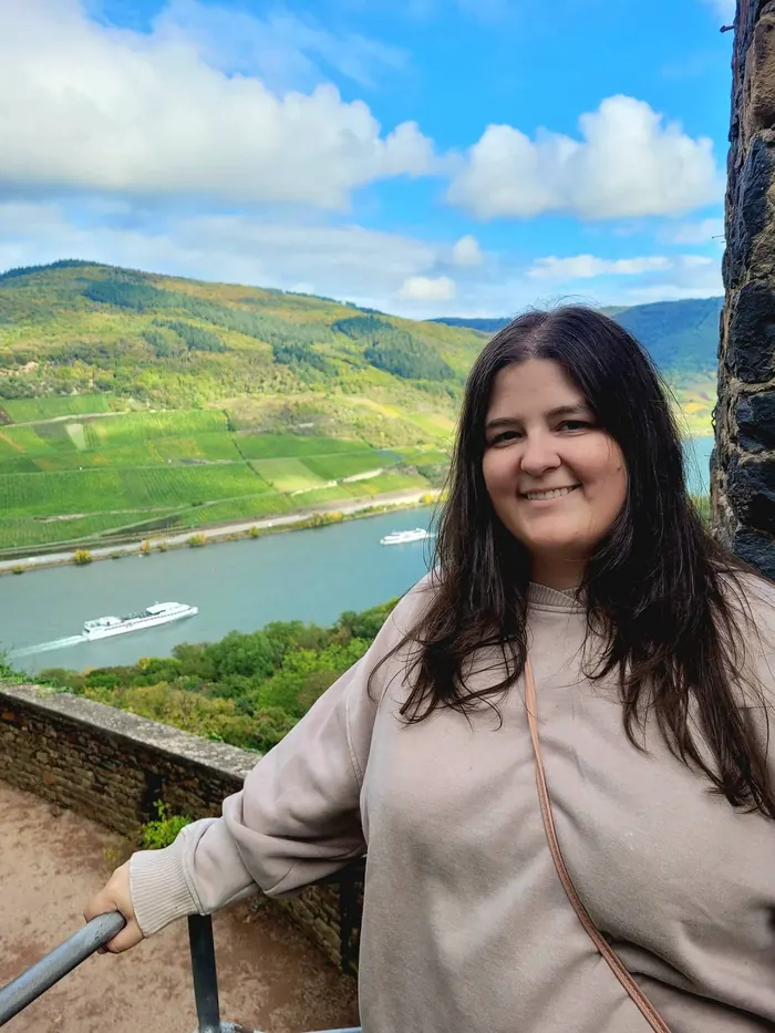 Jordan smiling above a river valley