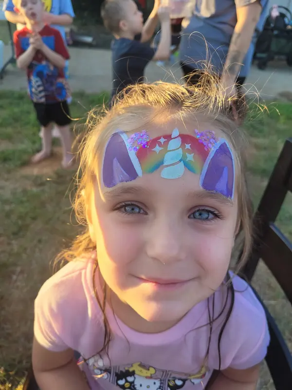 Child with a rainbow unicorn crown design