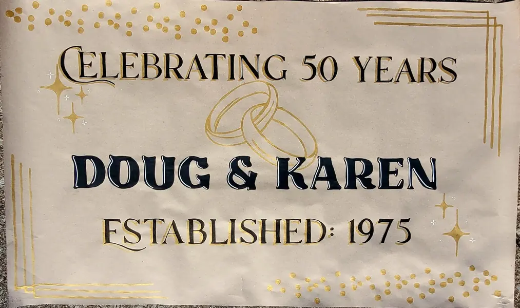 Celebrating 50 Years anniversary banner for Doug and Karen