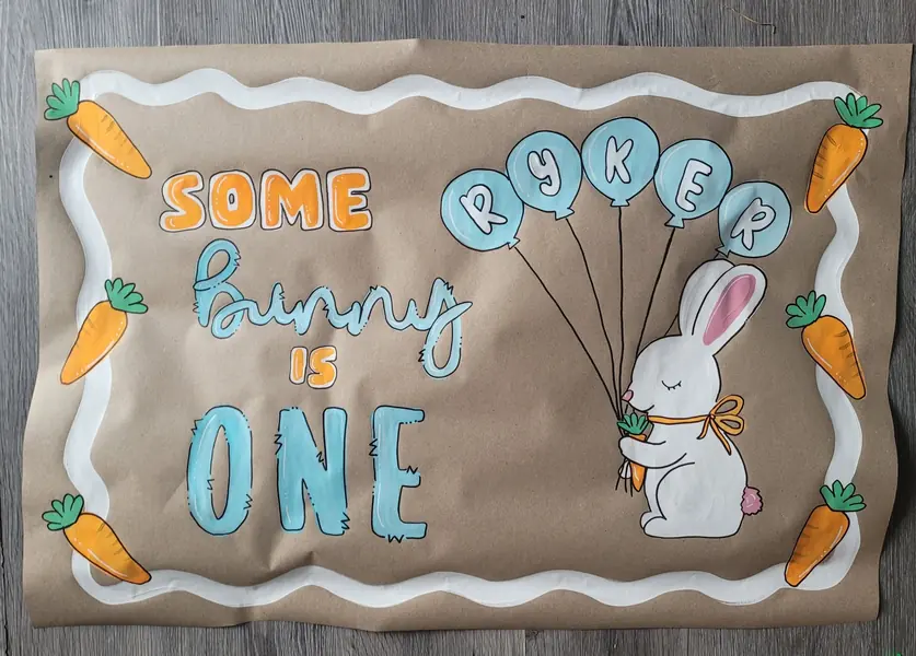 Some Bunny Is One birthday banner with balloons
