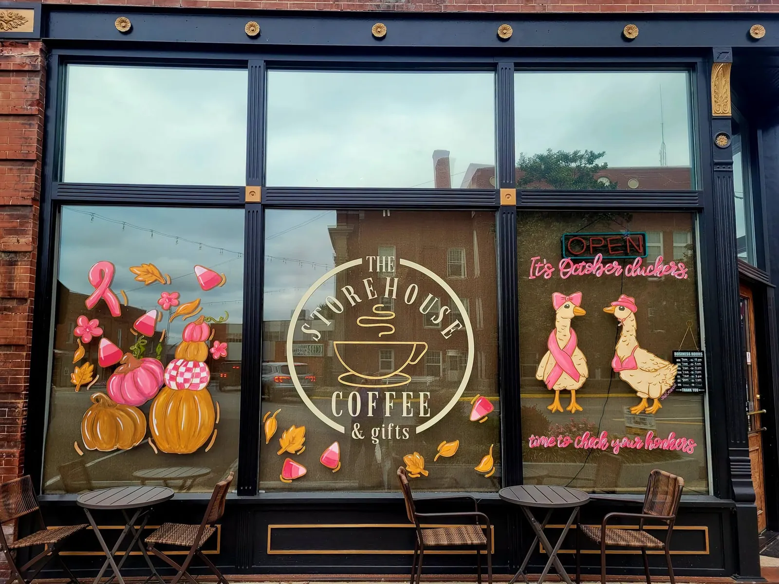 Coffee shop windows painted with pumpkins and geese