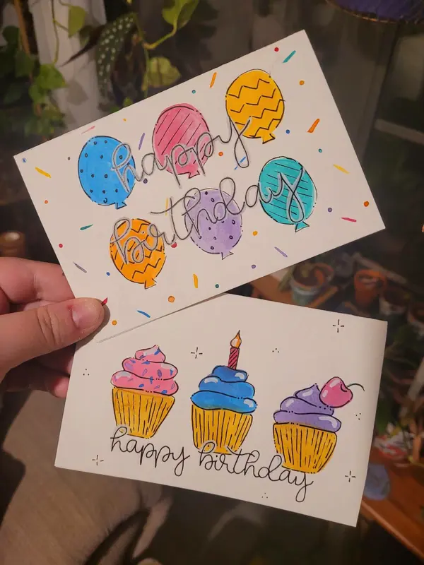 Hand-painted birthday cards with balloons and cupcakes
