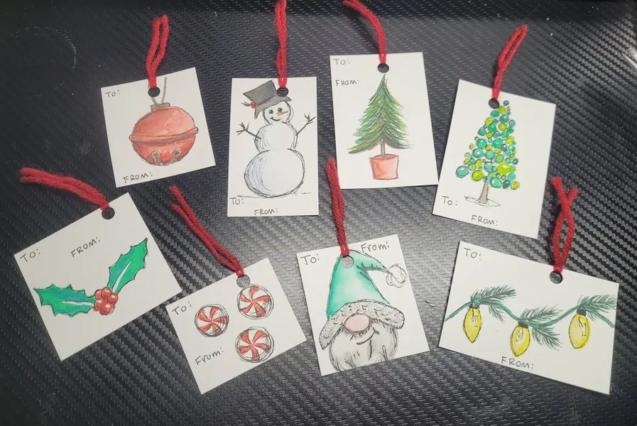 Hand-painted Christmas gift tags with ornaments, a snowman, trees and a gnome